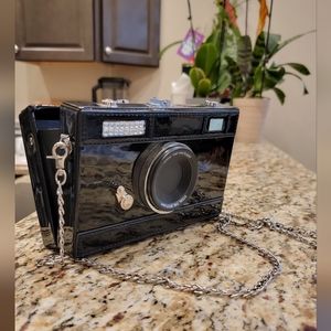 Bag/clutch in the form of a photocame